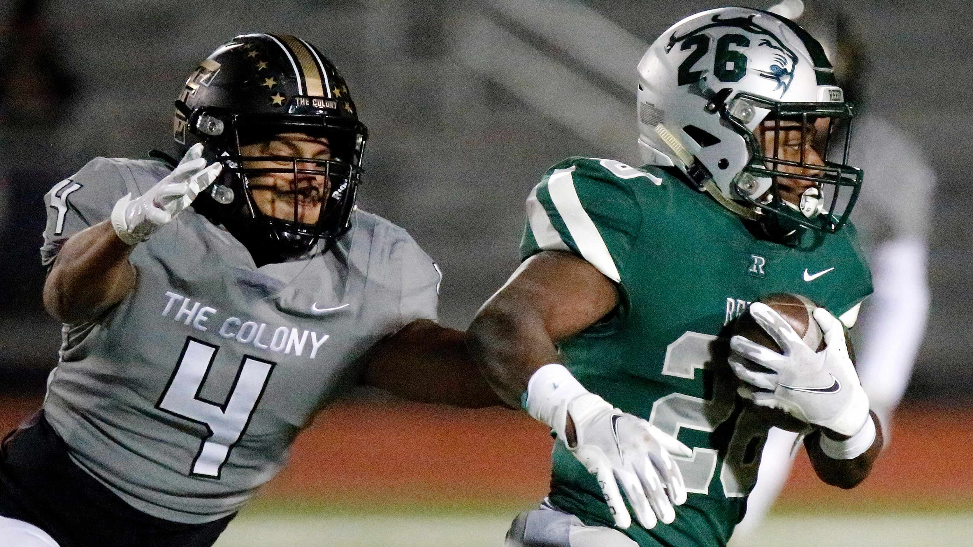 Frisco Reedy High School running back Aaron Daniels (26) escapes the tackle attempt by The...