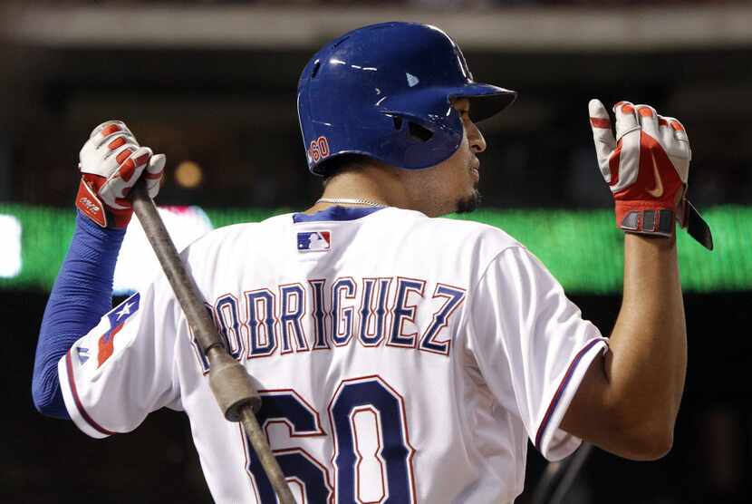 Texas Rangers' Guilder Rodriguez (60) stretches before batting during the eighth inning of a...