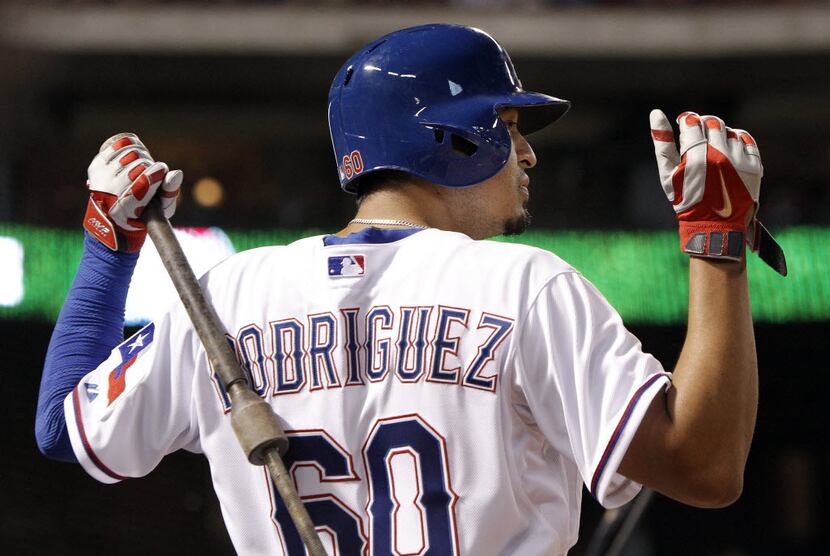 Texas Rangers' Guilder Rodriguez (60) stretches before batting during the eighth inning of a...