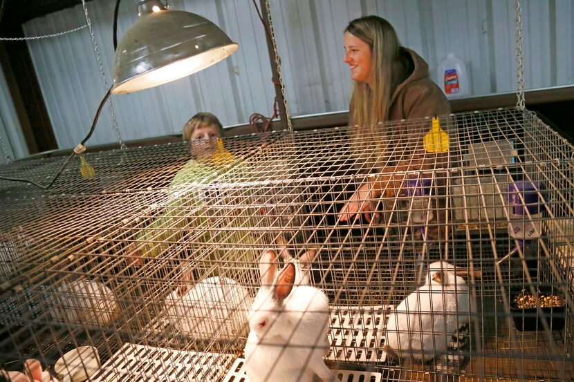 
Mariah Morgan and her brother, Max, 11, check on her rabbits every day to make sure they’re...