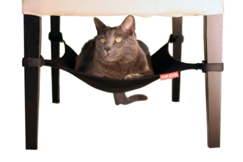 Felines can hang out under a table or chair in the space-efficient Cat Crib that attaches to...