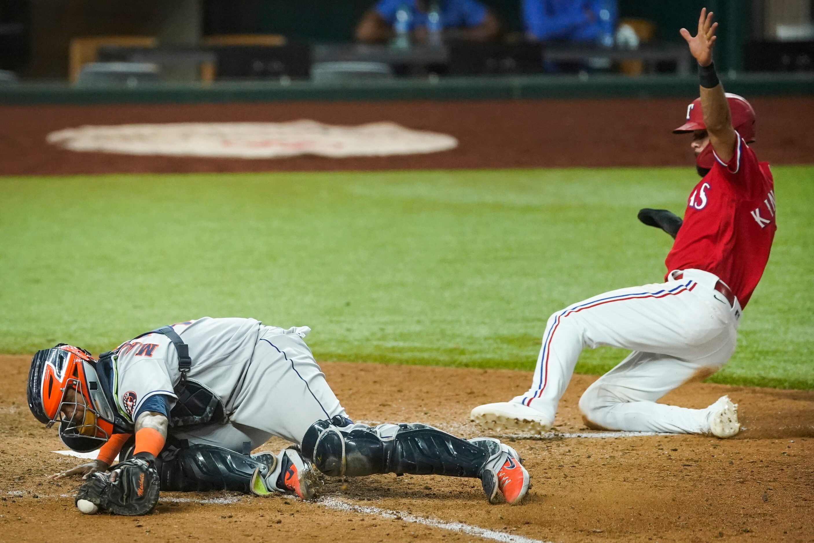 Texas Rangers shortstop Isiah Kiner-Falefa scores the game-winning run past Houston Astros...