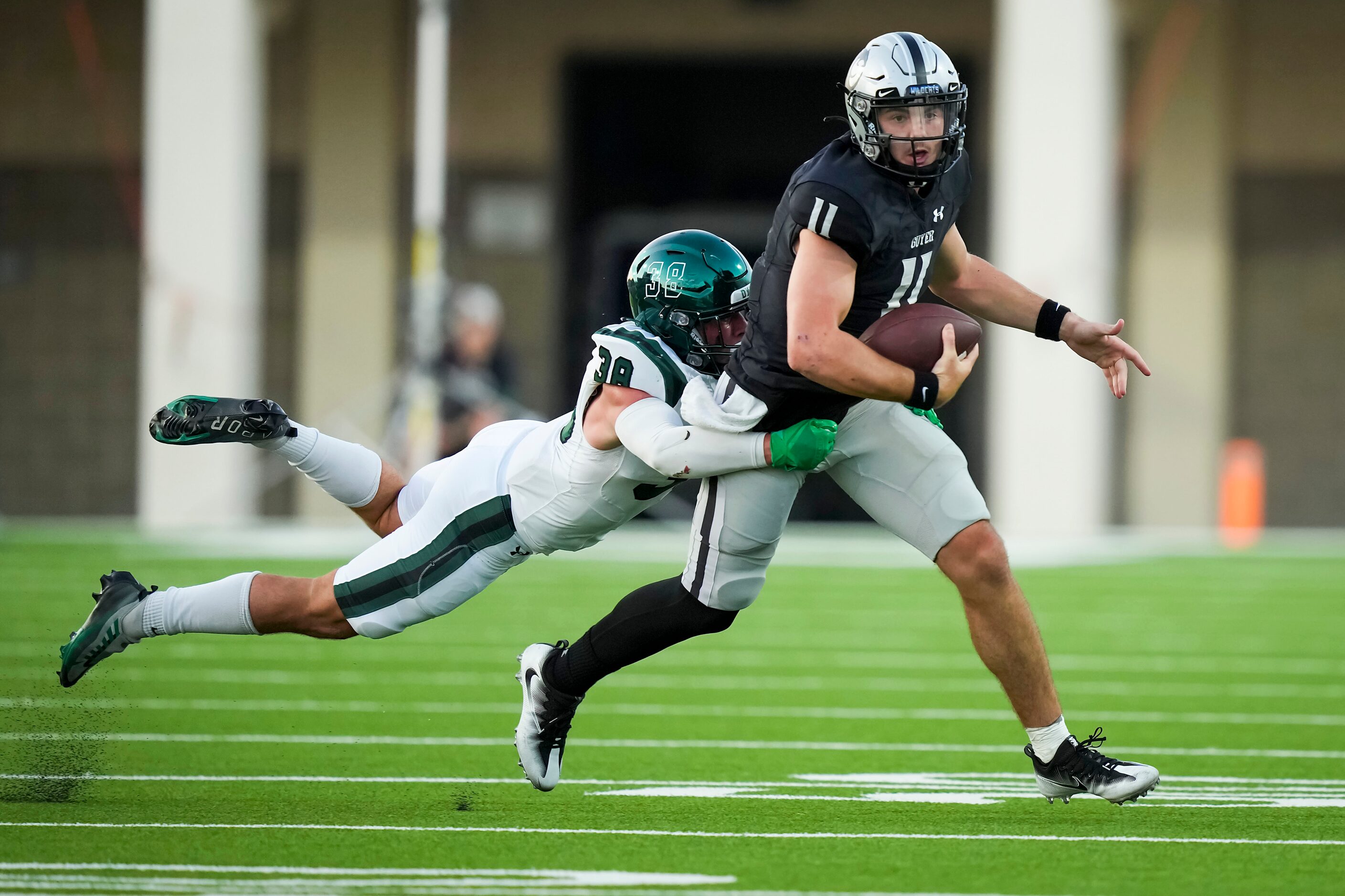 Denton Guyer quarterback Jackson Arnold (11) is dropped for a loss by Prosper linebacker...