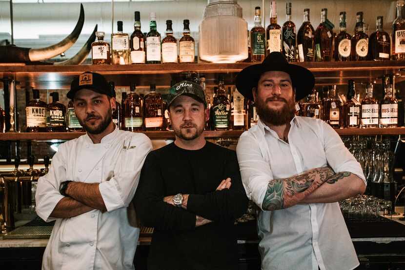 Austin Rodgers, center, is owner of Alamo Club on Lowest Greenville in Dallas. He's joined...