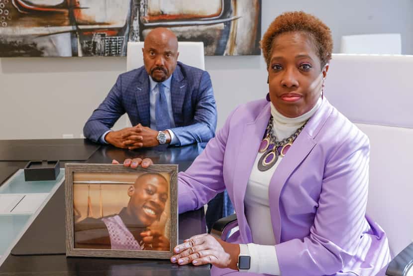 Attorney Daryl Washington (left) and his client Dee Crane pose for a photo on Nov. 2 in Dallas.