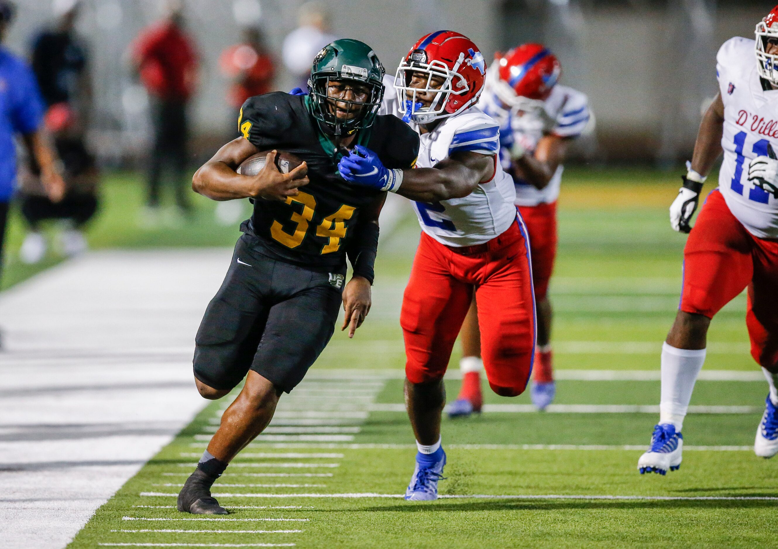 Duncanville senior linebacker Jordan Crook (2) forces DeSoto junior running back Keshaun...