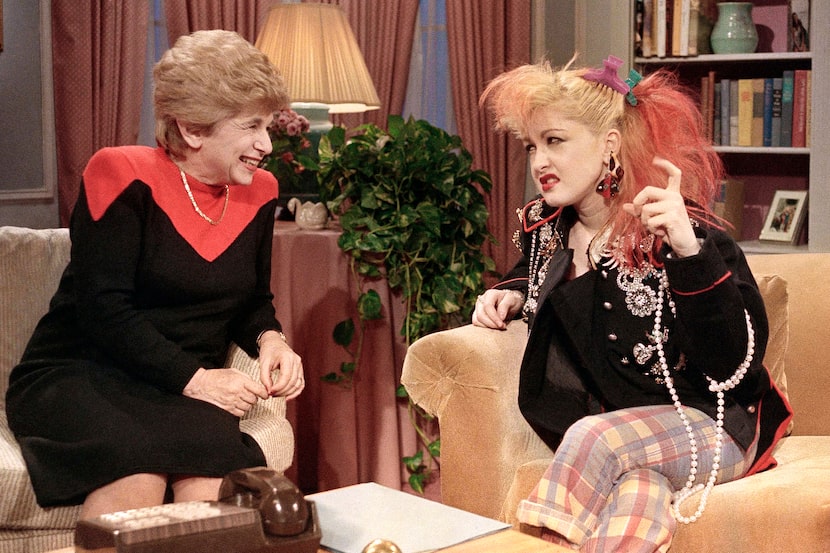 Dr. Ruth Westheimer talks with rock singer Cyndi Lauper in New York, on Jan. 17, 1985. 