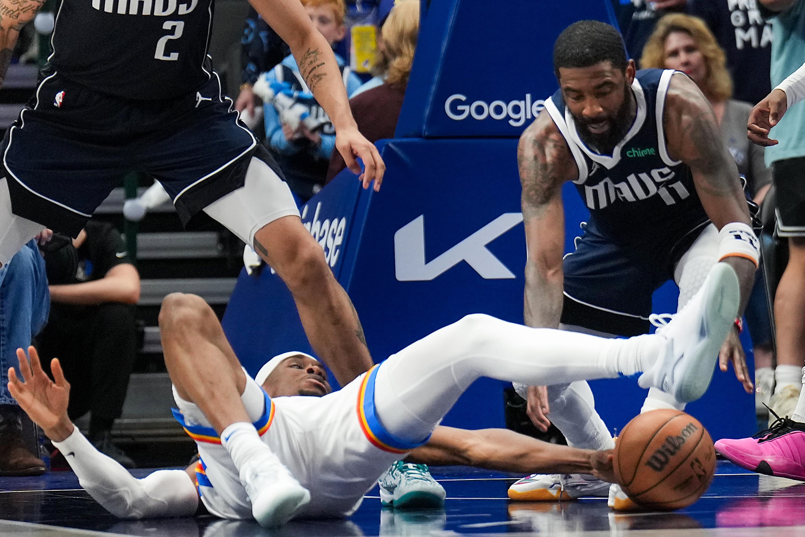 Dallas Mavericks guard Kyrie Irving (11) scoops up a loose ball on a turnover by Oklahoma...