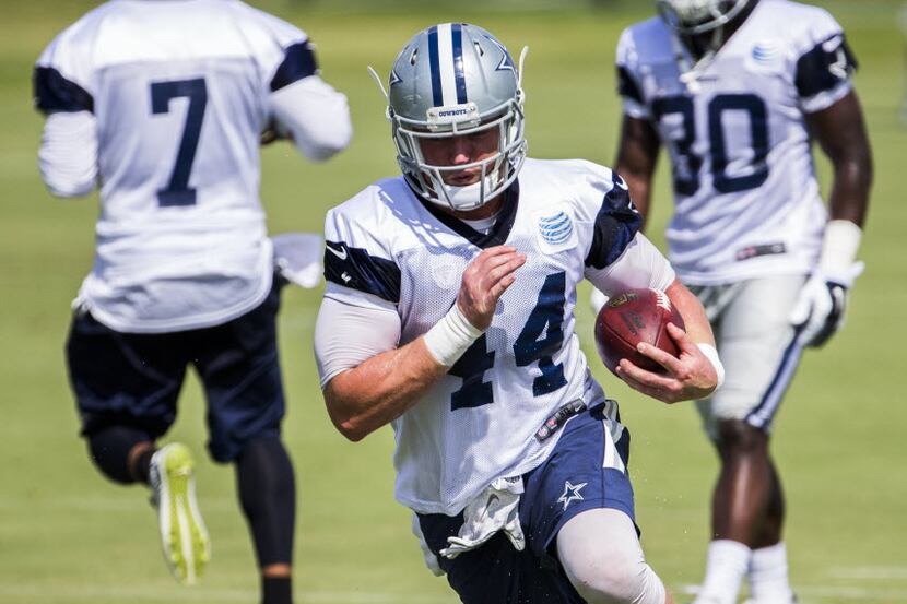 Dallas Cowboys fullback Tyler Clutts (44) runs after getting a handoff from  practice squad...
