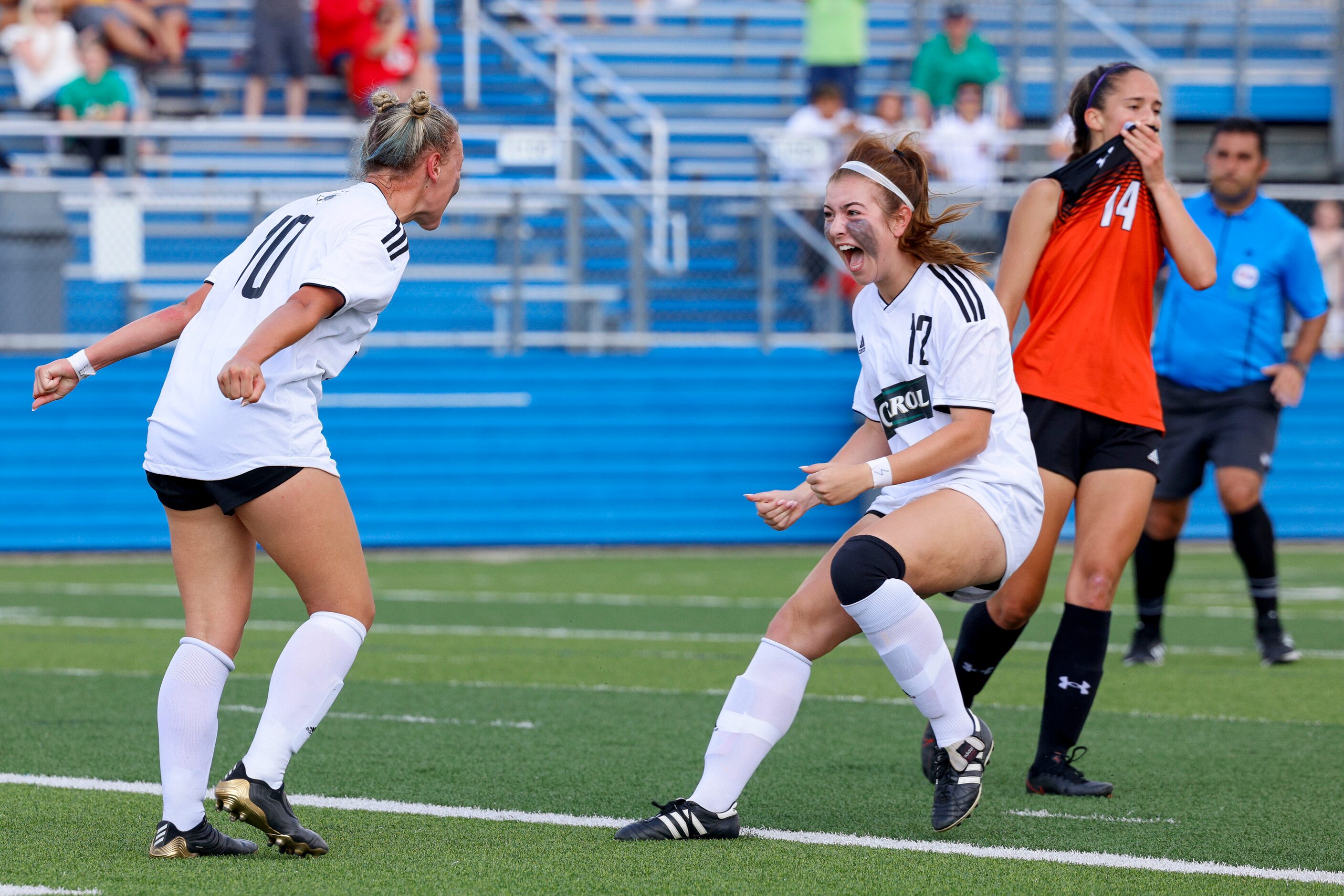 Southlake Carroll midfielder Kennedy Fuller (10) celebrates a goal with midfielder Madison...