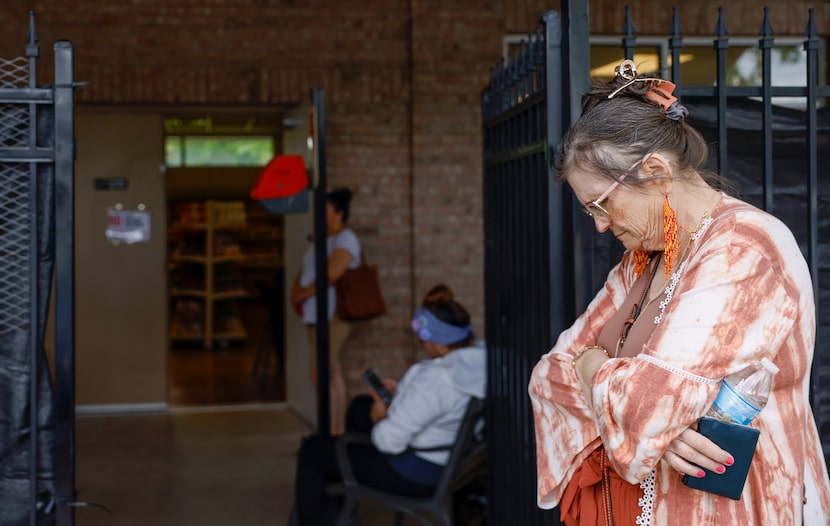 Dixie Perkins waited outside Community Food Pantry for her number to be called in McKinney...