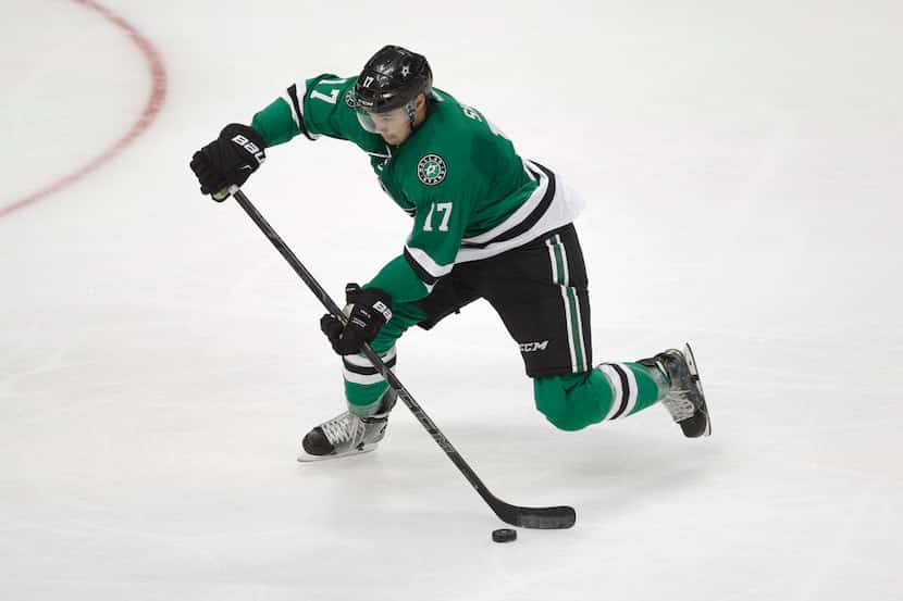 Dallas Stars center Devin Shore passes the puck during an NHL preseason hockey game against...