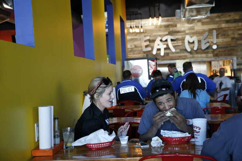 Bridgette Johns (left) and Devon Manning eat at Fuzzy's Taco Shop in Frisco March 1, 2016....