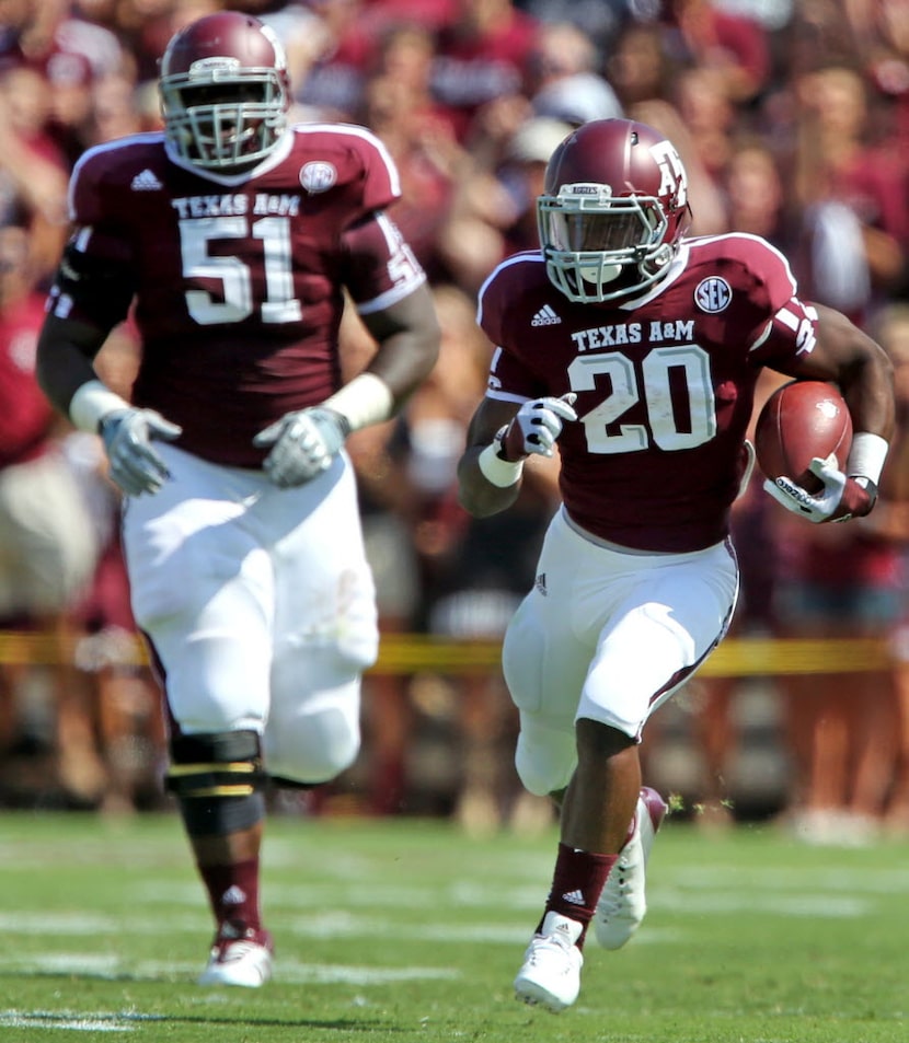 Aggies running back Trey Williams (20) and offensive lineman Jarvis harrison are pictured...