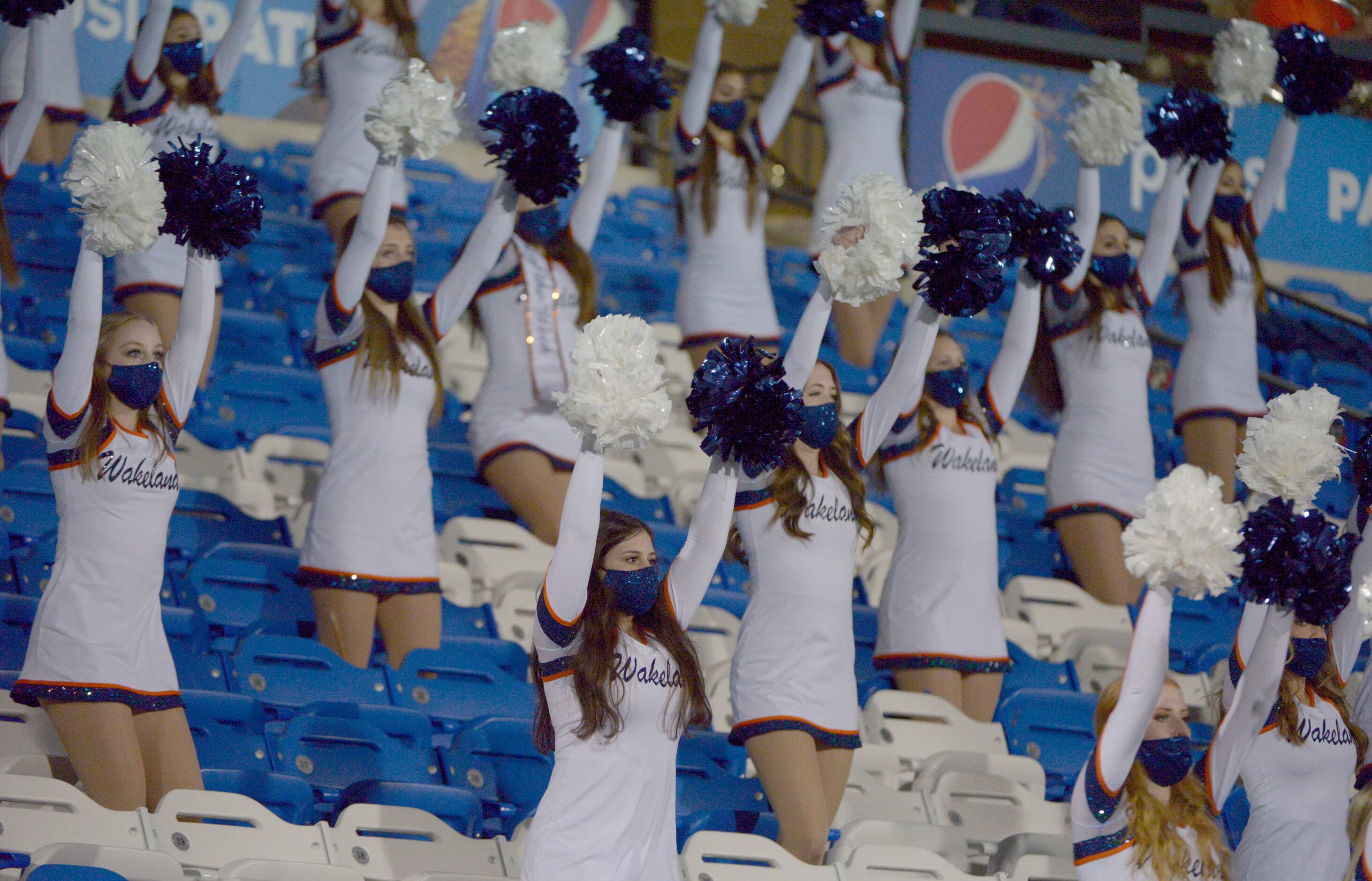 Members of the Lakeland Legacy Line perform in the first quarter of a high school football...