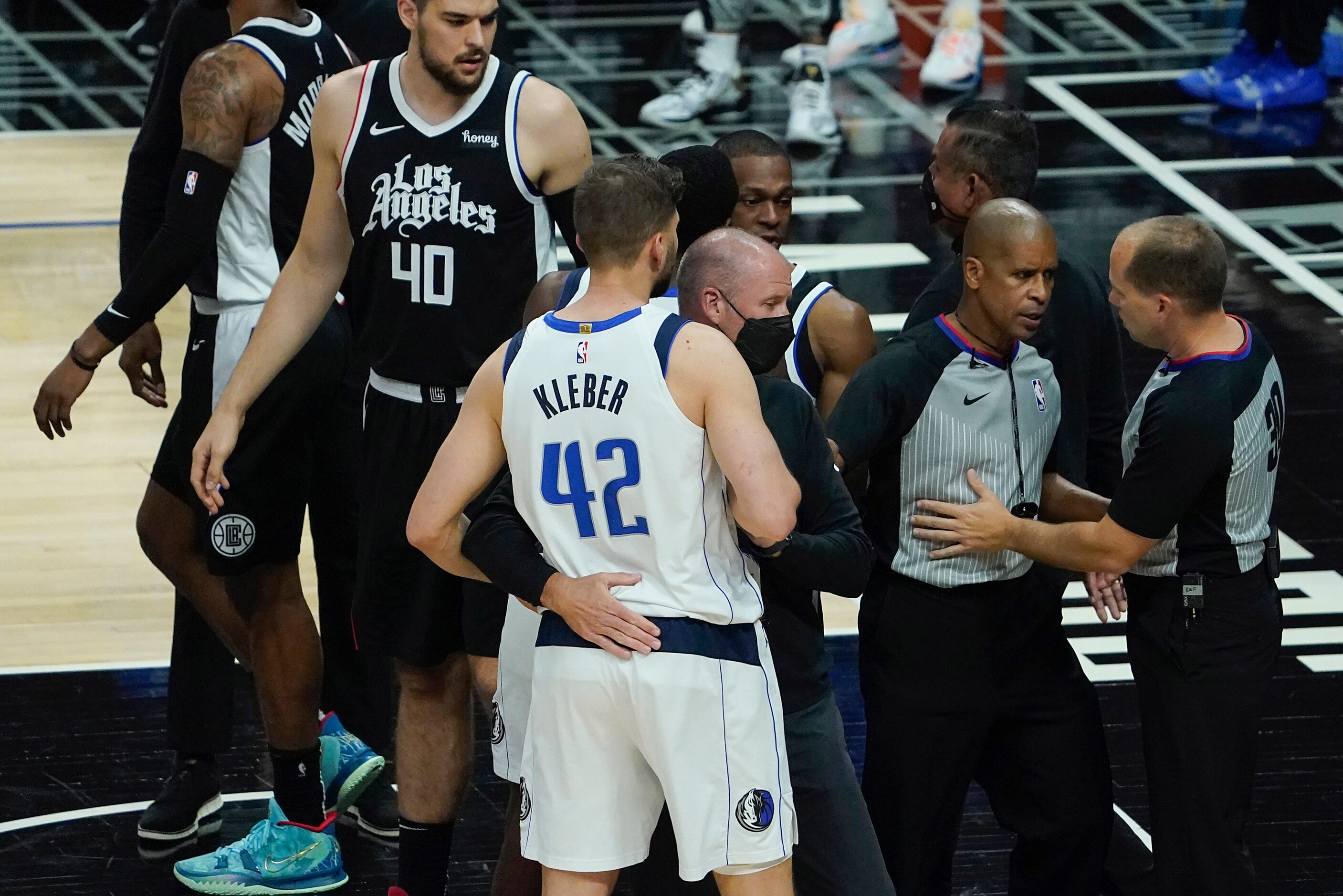 Officials separate Dallas Mavericks forward Maxi Kleber from LA Clippers forward Marcus...