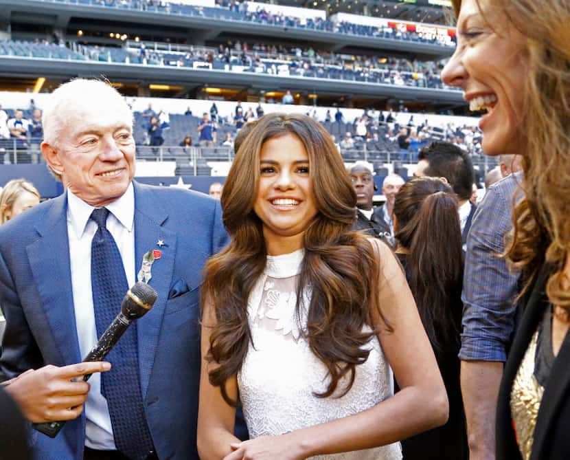 Dallas Cowboys owner Jerry Jones poses with singer and actress Selena Gomez, who will...