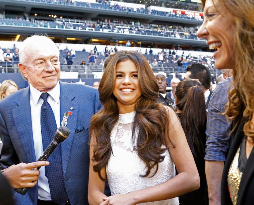 Dallas Cowboys owner Jerry Jones poses with singer and actress Selena Gomez, who will...