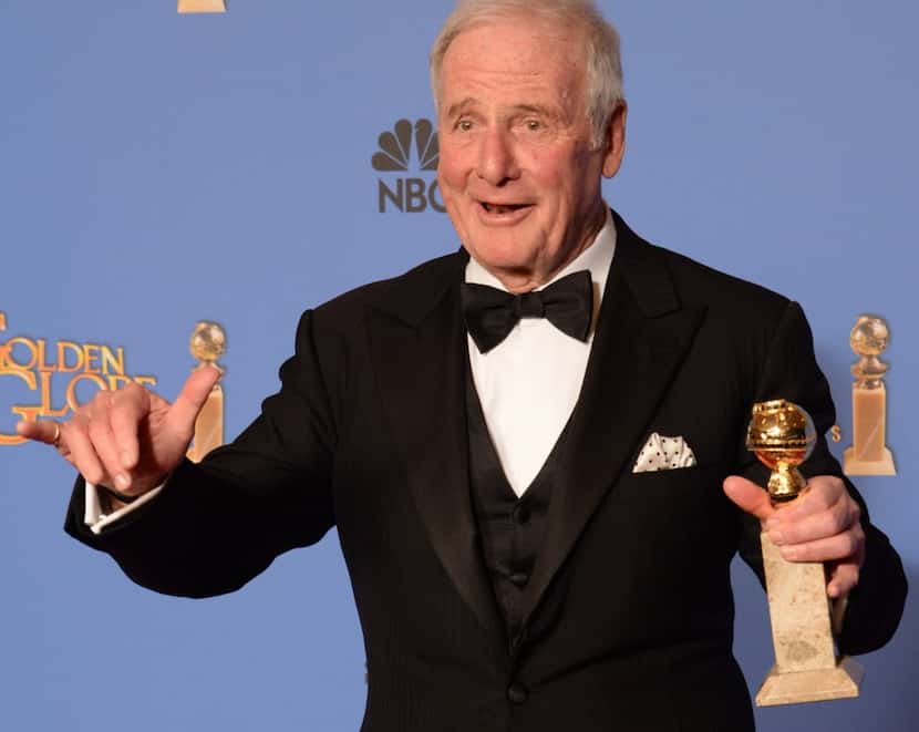 Producer Jerry Weintraub holds his trophy  in the press room after winning Best Mini-Series...