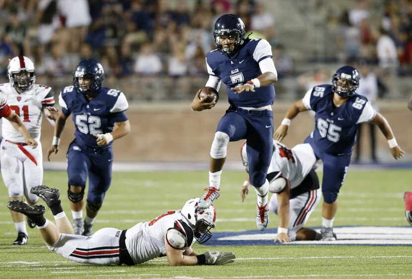 Allen's Seth Green (7) escapes the grasp of Flower Mound Marcus' Hawkens Taylor (89) on a...