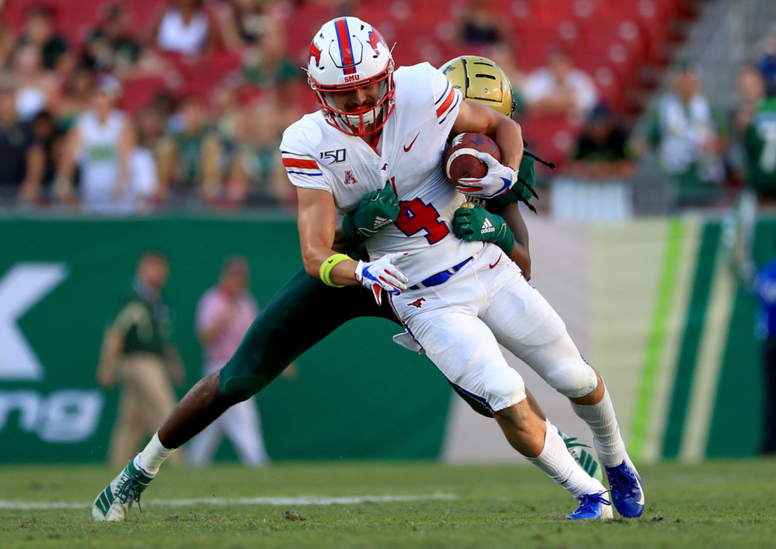 TAMPA, FLORIDA - SEPTEMBER 28: Tyler Page #4 of the Southern Methodist Mustangs makes a...