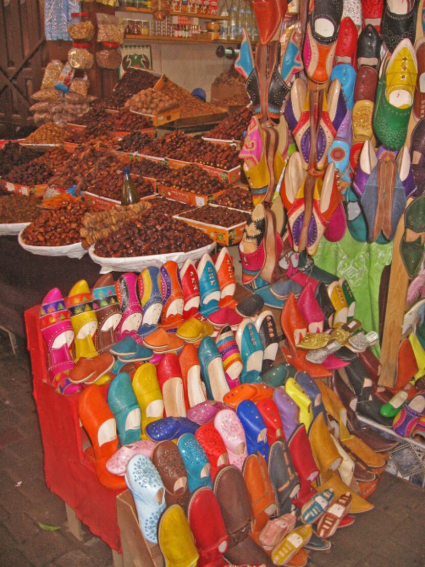This January 2013 shows two traditional Moroccan products -- dates and leather slippers --...