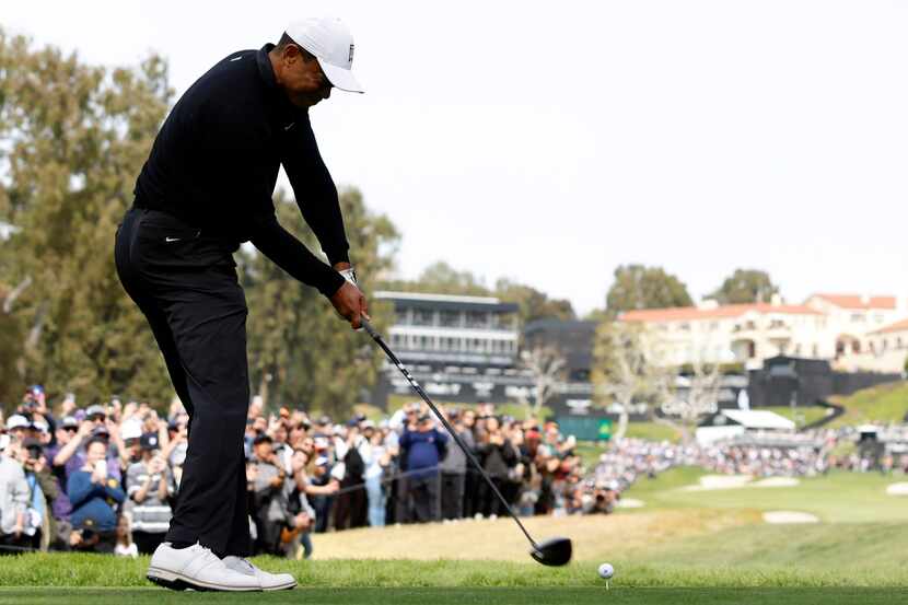 Tiger Woods hits from the ninth tee during the second round of the Genesis Invitational golf...