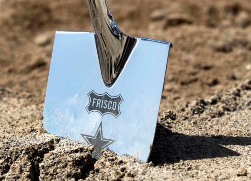 
The silver shovels used for the groundbreaking bore the logs of the Cowboys, the city and...