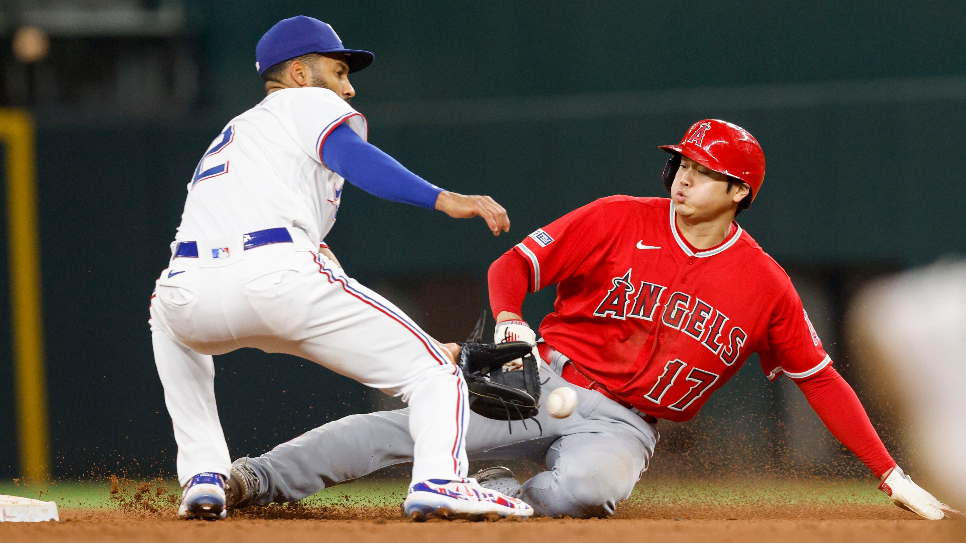 Los Angeles Angels designated hitter Shohei Ohtani (17) safely steals second base ahead of a...