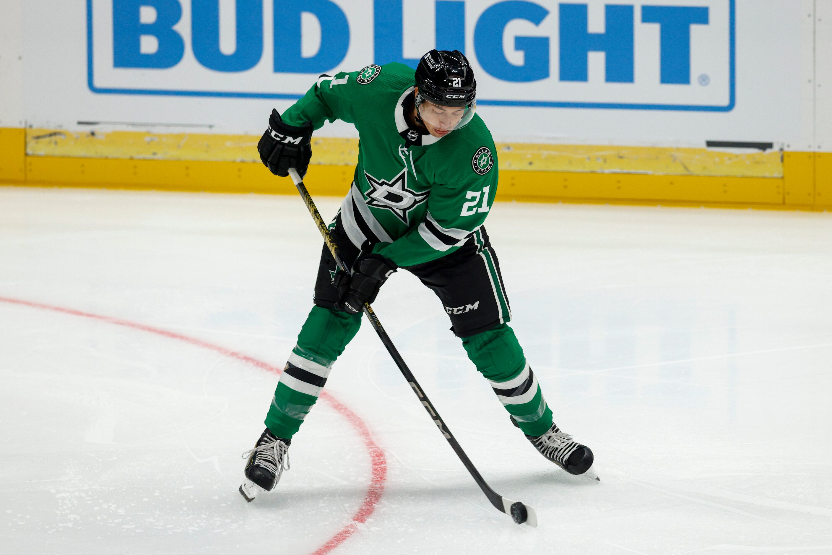 Dallas Stars left wing Jason Robertson (21) handles the puck during the first period of an...