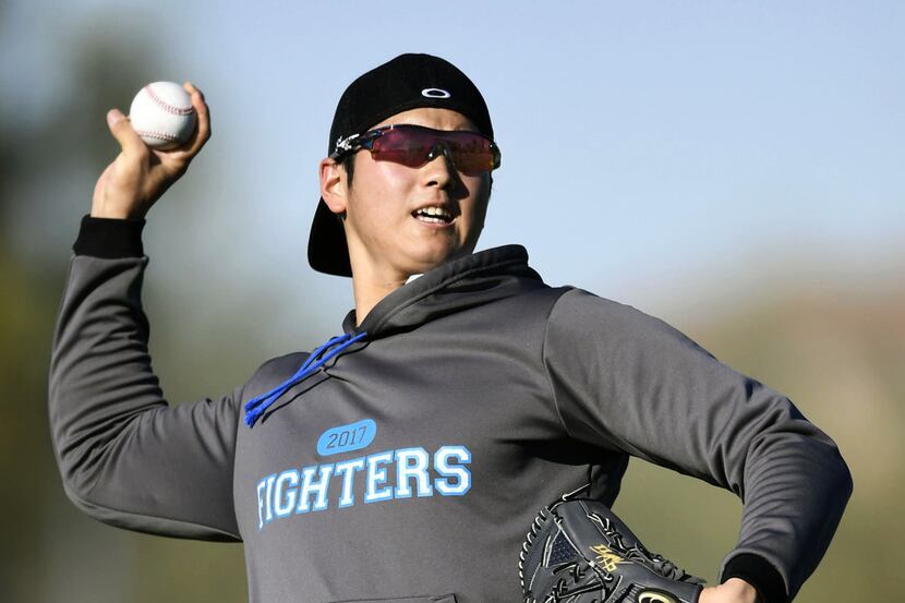FILE - In this Jan. 31, 2017, file photo, Japanese baseball player Shohei Otani pitches the...