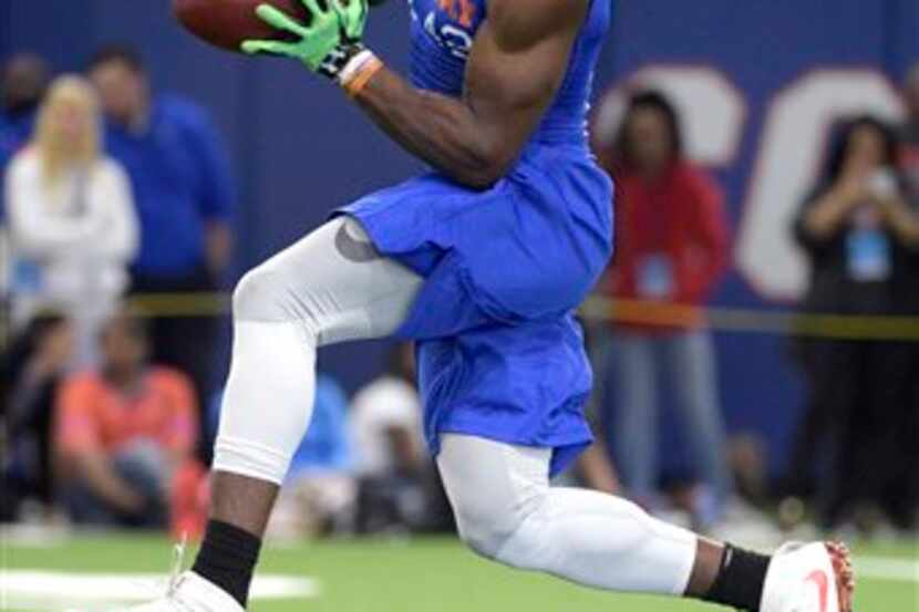 Defensive back Keanu Neal catches a pass during a drill at Florida's NFL Pro Day in...