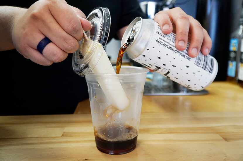 Barista Andrew Rodriguez makes a KiestPop at Peaberry Coffee in Dallas.