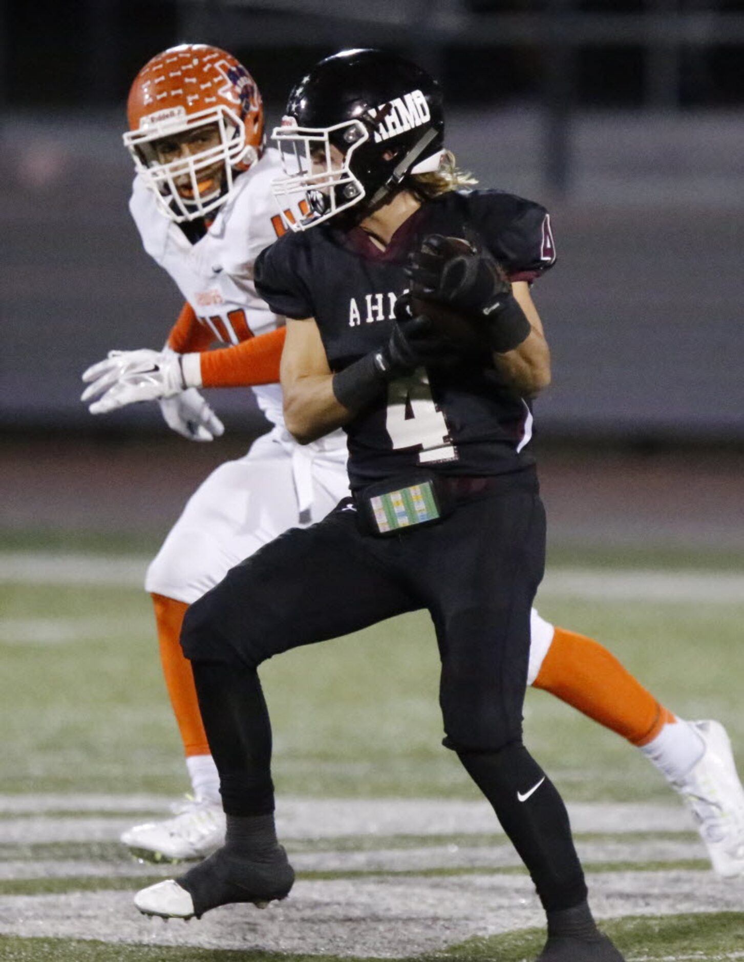 Wylie High School wide receiver Kollier Knight (4) catches a pass in front of McKinney North...