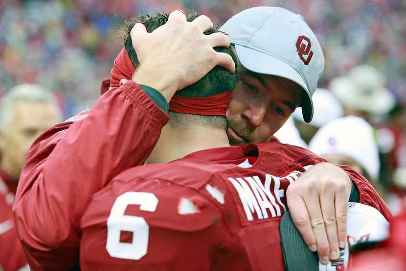NORMAN, OK - DECEMBER 3: Lincoln Riley, offensive coordinator for the Oklahoma Sooners, hugs...