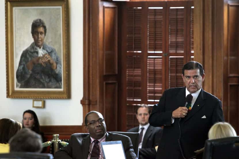  State Sen. Eddie Lucio Jr. of Brownsville (right) on the Texas Senate floor in 2013. (Louis...