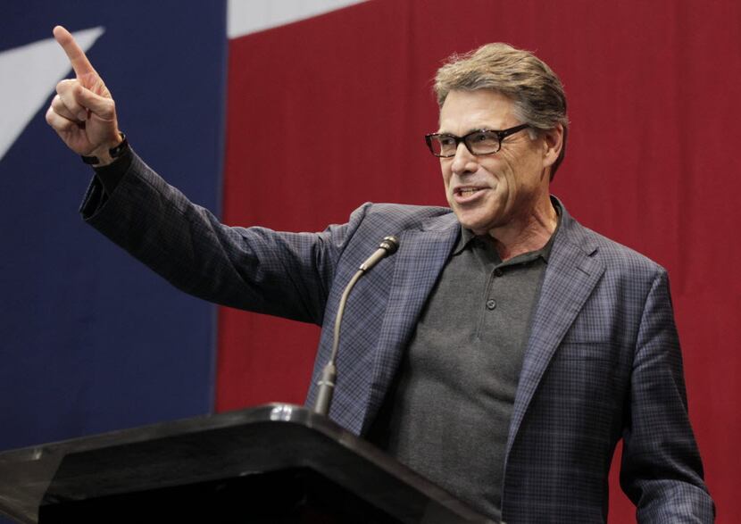 In this Nov. 4, 2014 file photo, Rick Perry speaks at Texas Governor elect's Greg Abbott...