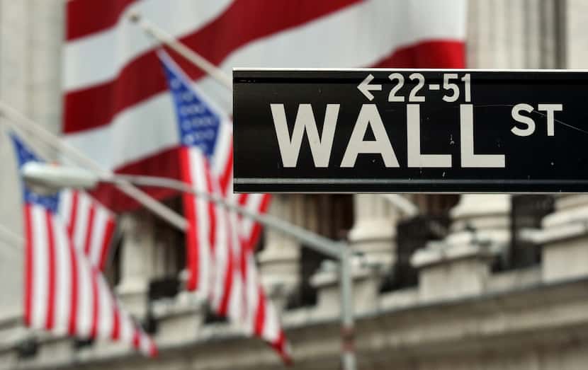 (FILES)The Wall Street sign near the front of the New York Stock Exchange is viewed in this...