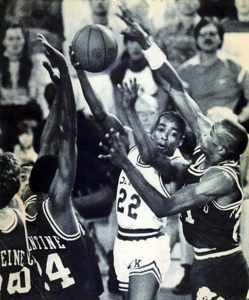 ANCHORAGE, ALASKA - November 28, 1983 - North Carolina State's Spud Webb flips the ball to a...