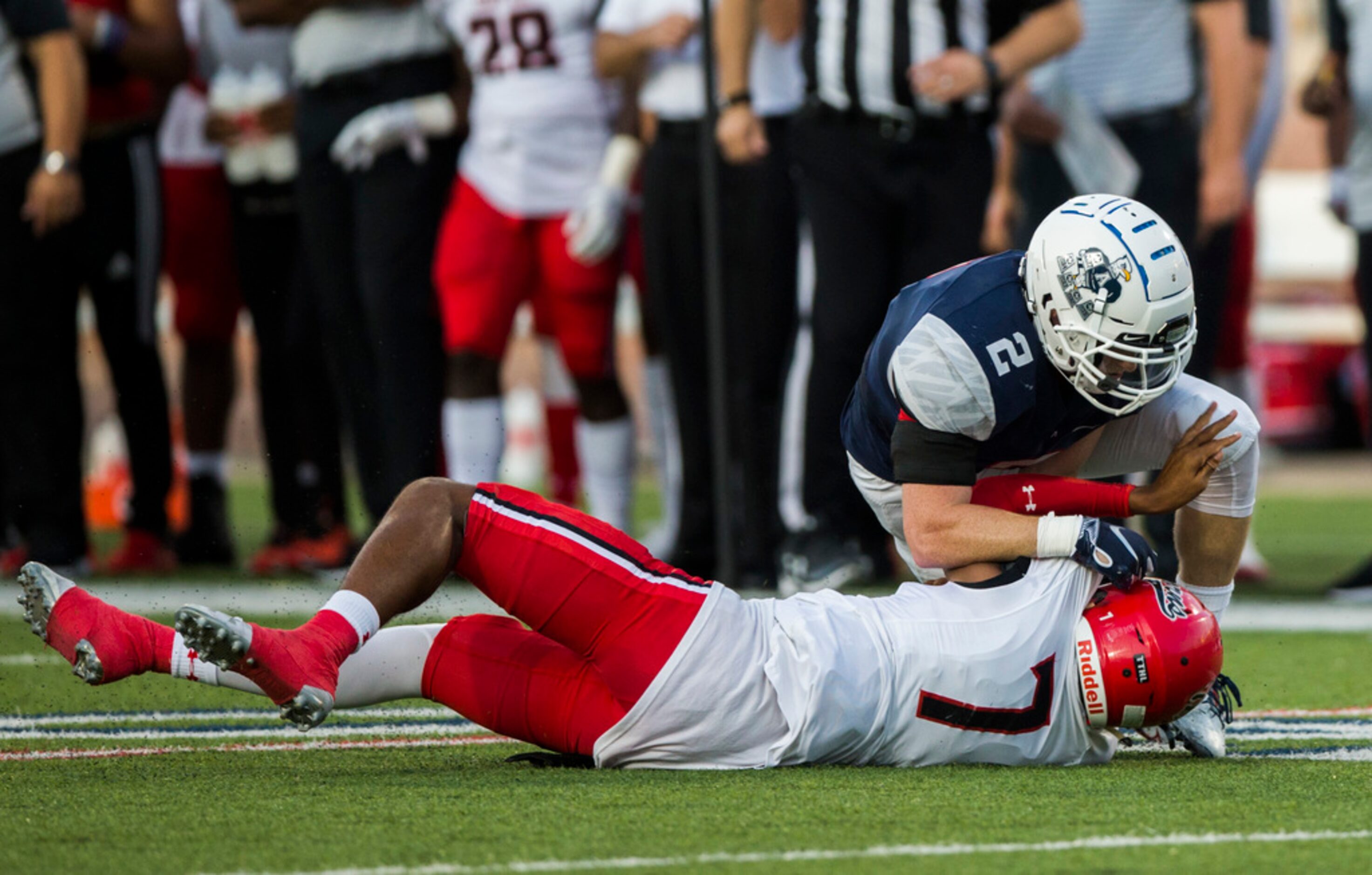 Cedar Hill quarterback Kaidon Salter (7) is sacked by Allen linebacker Jaden Healy (2)...