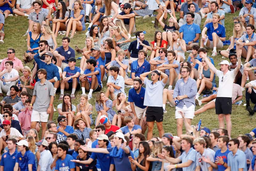 The SMU student section reacts to a replay call of an interception during the first half as...