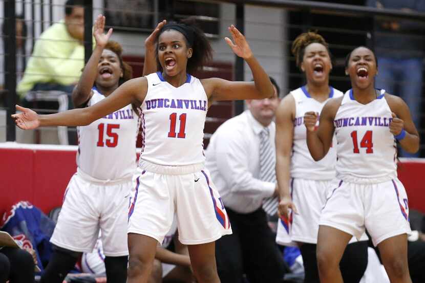 Duncanville senior guard Chrineisha Davis (11) and her teammates celebrate a play during the...