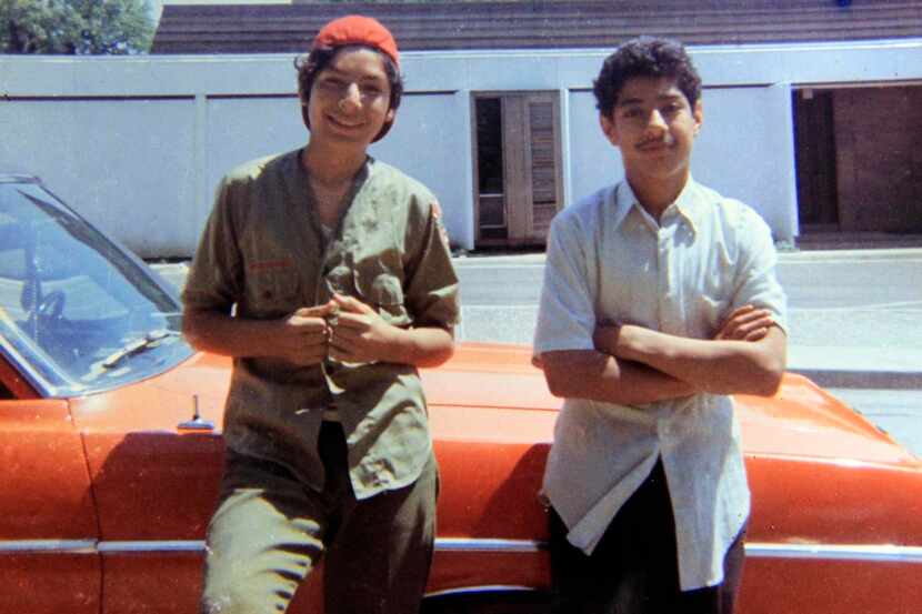 
Santos Rodriguez, 12, (right) and his brother, David, 13, stand by a relative’s car in 1973...