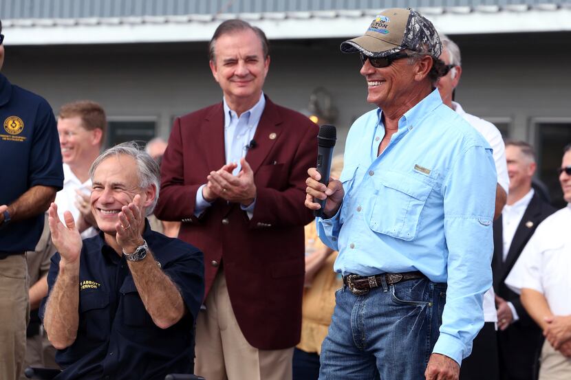 Texas Gov. Greg Abbott, left, John Sharp, head of the Governor's Commission to Rebuild...
