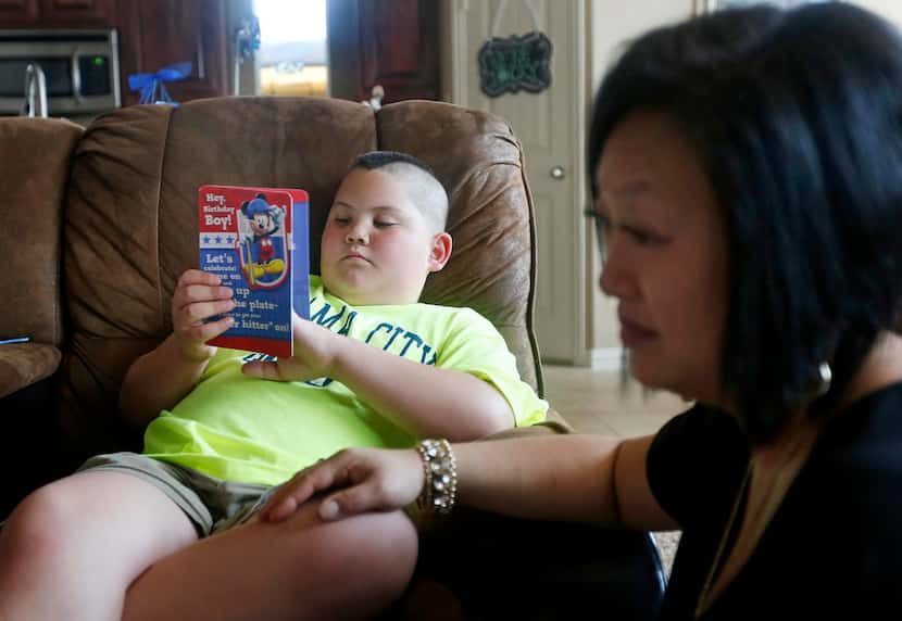Hunter Kleis read birthday cards with his mother,  Amy, on Sunday. On Monday, Hunter’s...