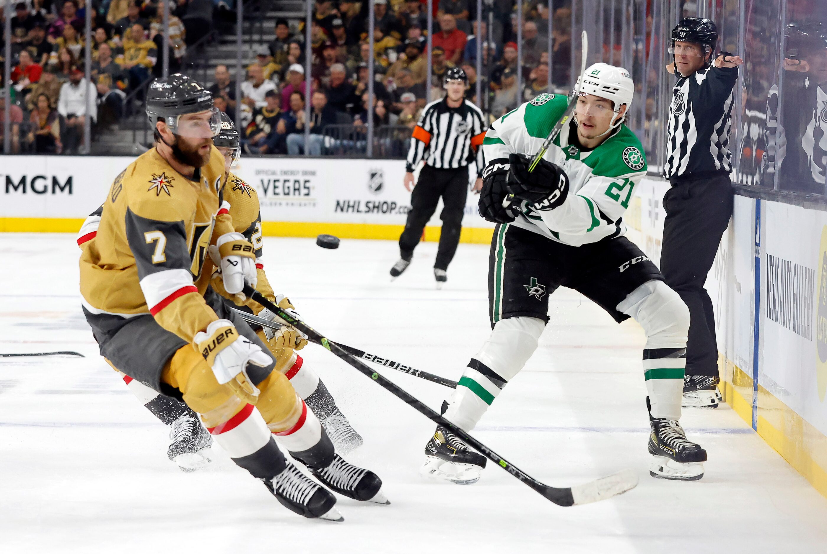 Dallas Stars left wing Jason Robertson (21) shoots the puck toward the net as he was pursued...