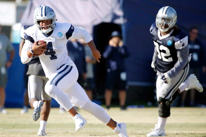 Dallas Cowboys quarterback Dak Prescott (4) runs up the field on a run play during the...