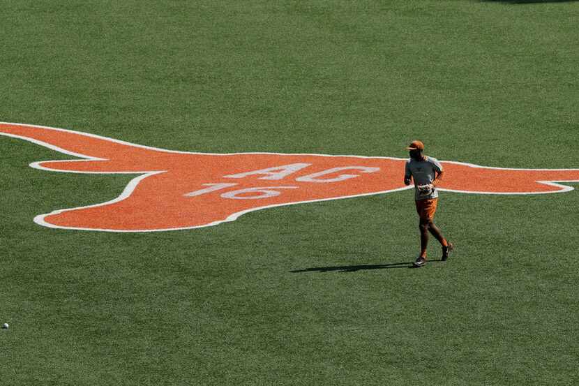 In this Wednesday, June 6, 2018, photo, a player runs past a team logo honoring long-time...