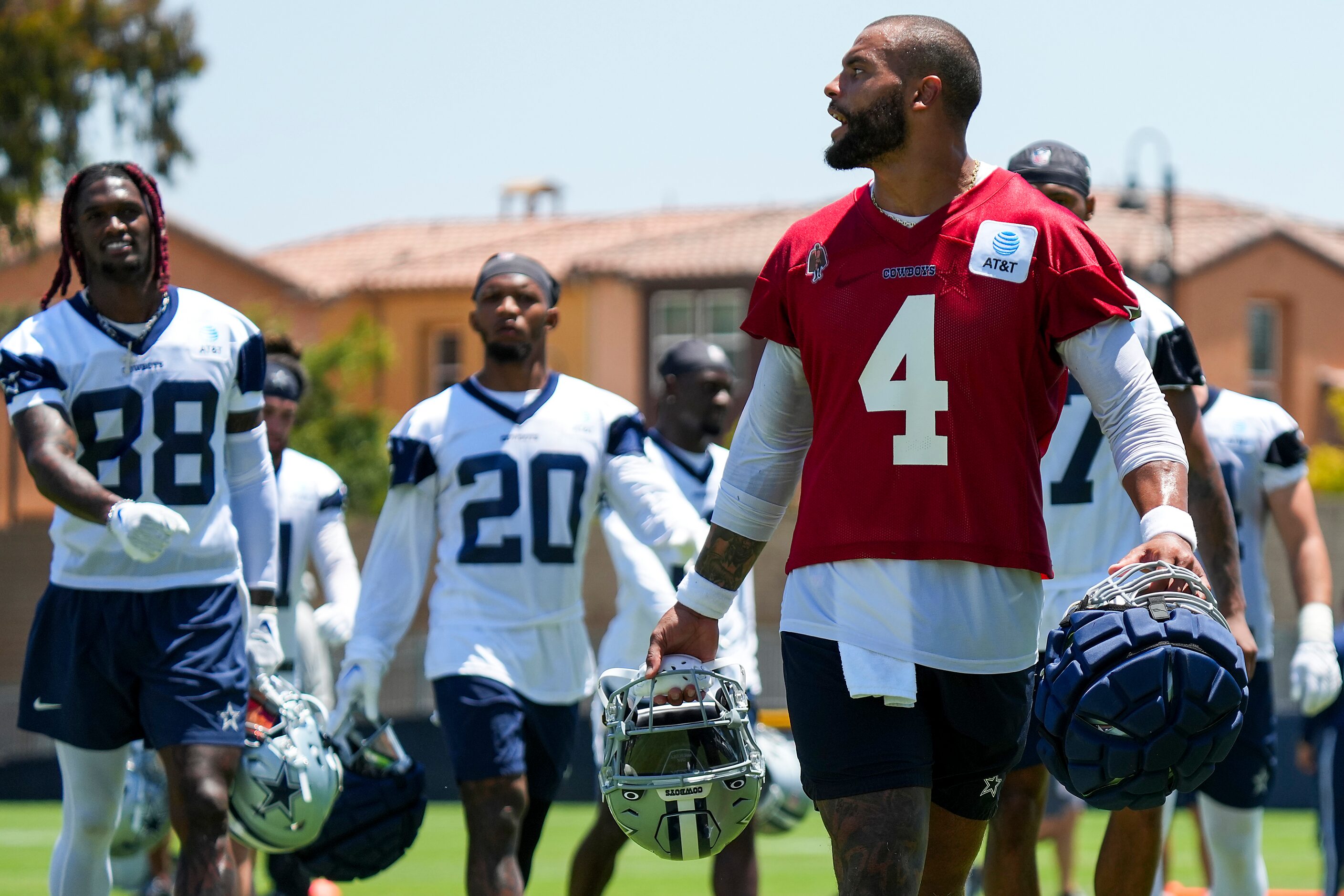 Dallas Cowboys quarterback Dak Prescott (4) yells toward cornerback Trevon Diggs during the...