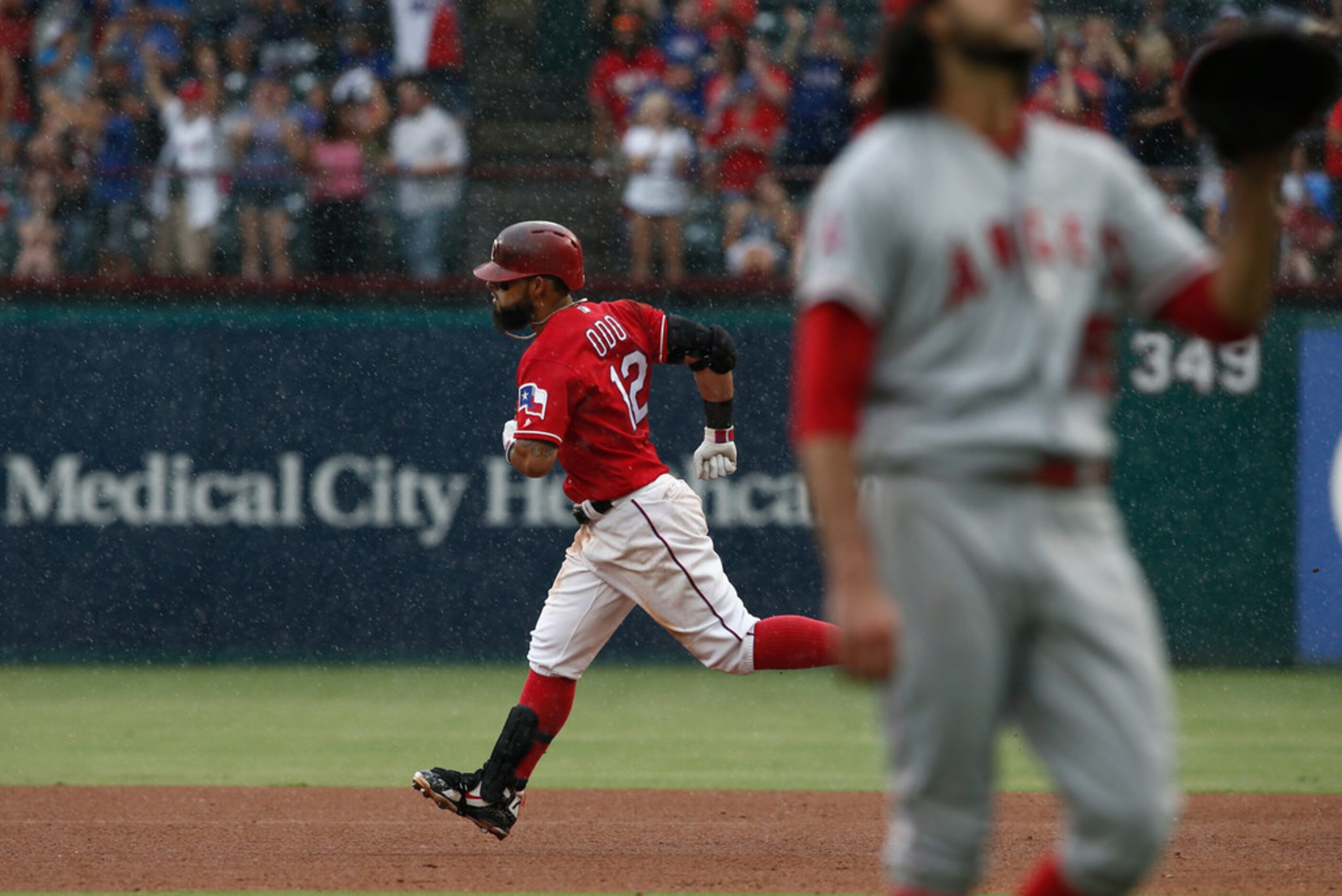 Texas Rangers' Rougned Odor (12) rounds the bases after hitting a three-run home run off of...